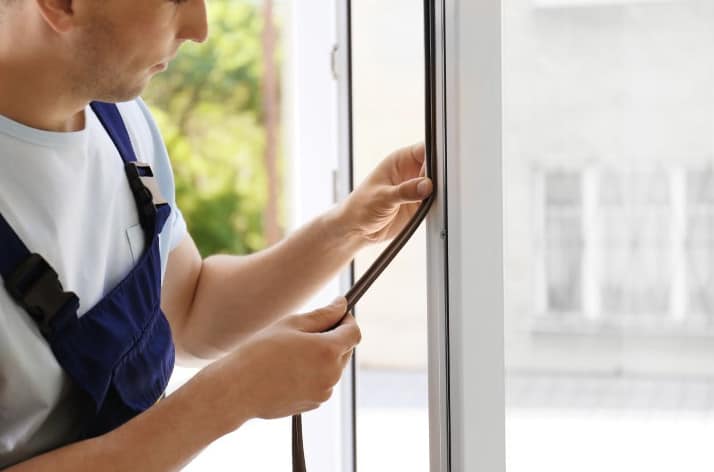 Technician performing window fix in a Grand Junction home