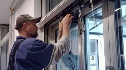 Technician repairing commercial door not locking in Glenwood Springs