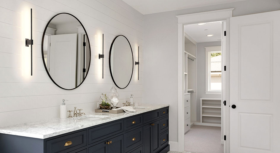 Professional installation of a custom vanity mirror in a bathroom in Glenwood Springs Colorado.