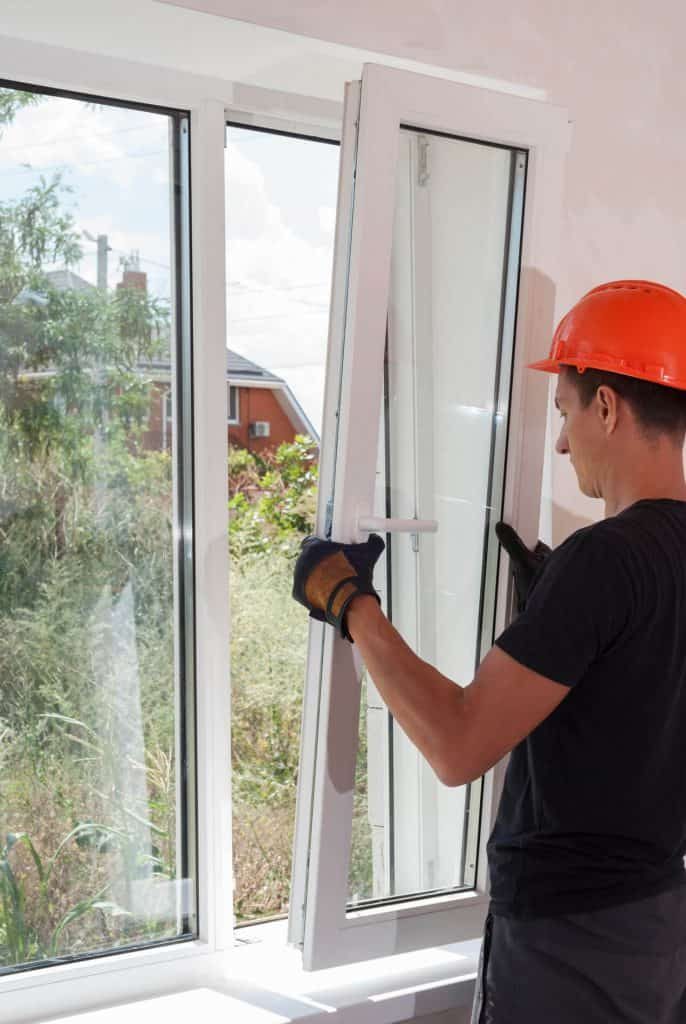 Technician performing glass repair in Glenwood Springs storefront window