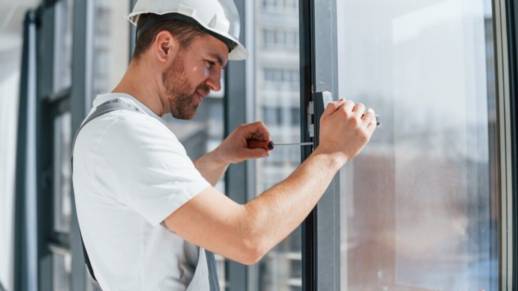 Professional technician repairing residential and commercial windows in Glenwood Springs, Colorado.