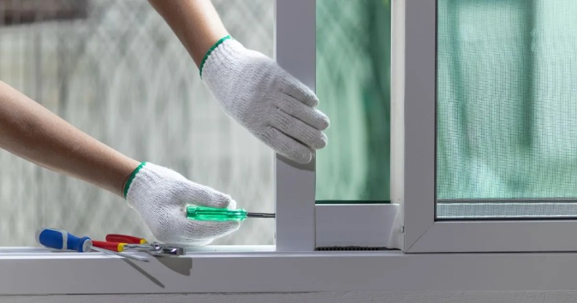 Professional technician performing window repair in Glenwood Springs