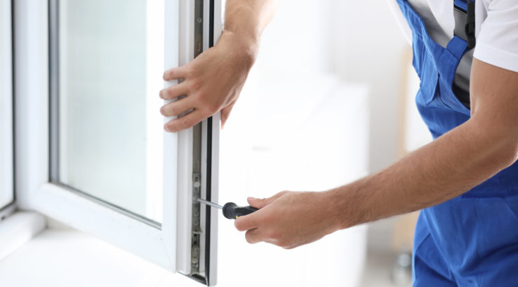 Professional technician repairing a window in Rifle
