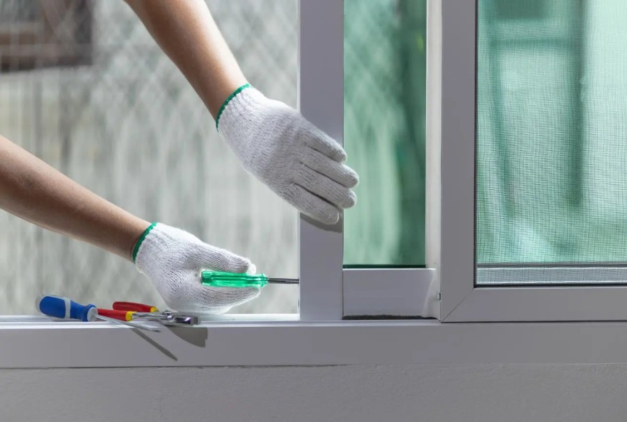 Professional technician repairing commercial and residential doors in Glenwood Springs, Colorado.