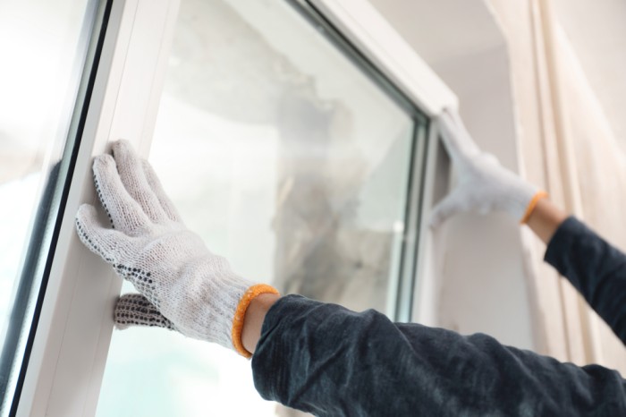 Professional technician repairing residential and commercial windows in Glenwood Springs, Colorado.