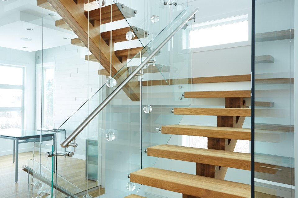 Custom glass hand railing installed on a staircase in Glenwood Springs, Colorado.