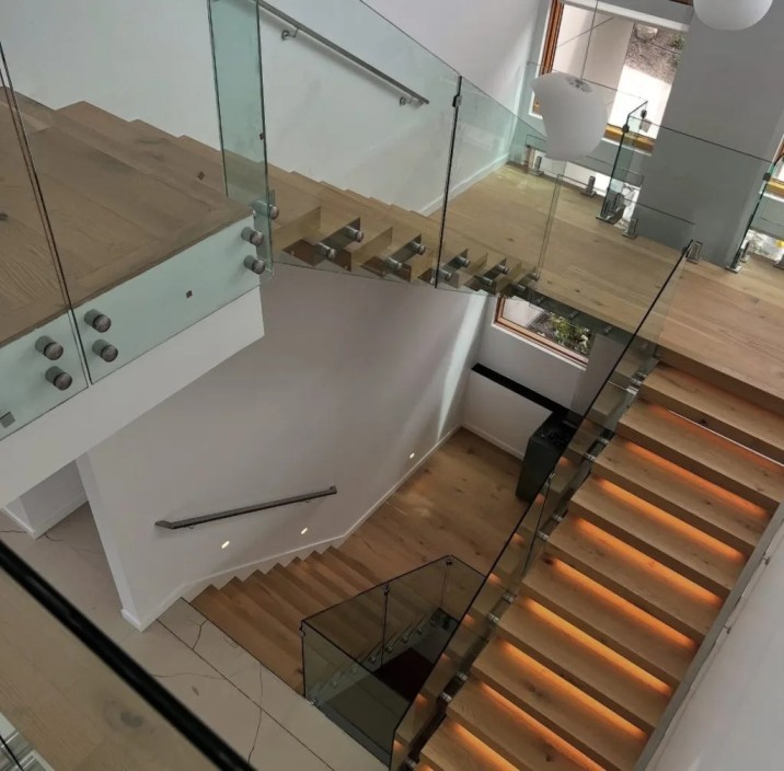 Custom glass hand rail installed on a staircase in Glenwood Springs, Colorado.