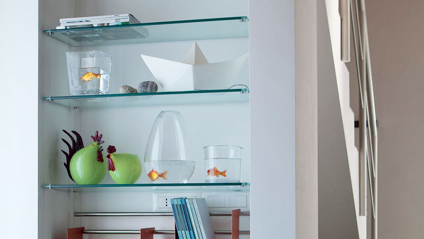 Custom glass shelves installed in a modern bathroom in Glenwood Springs, Colorado.