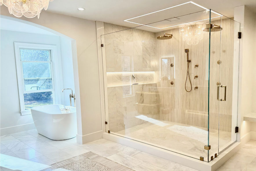 Custom frameless glass shower enclosure professionally installed in a Glenwood Springs, Colorado bathroom.