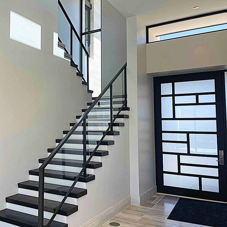 Custom glass hand railing installed on a staircase in Grand Junction, Colorado.
