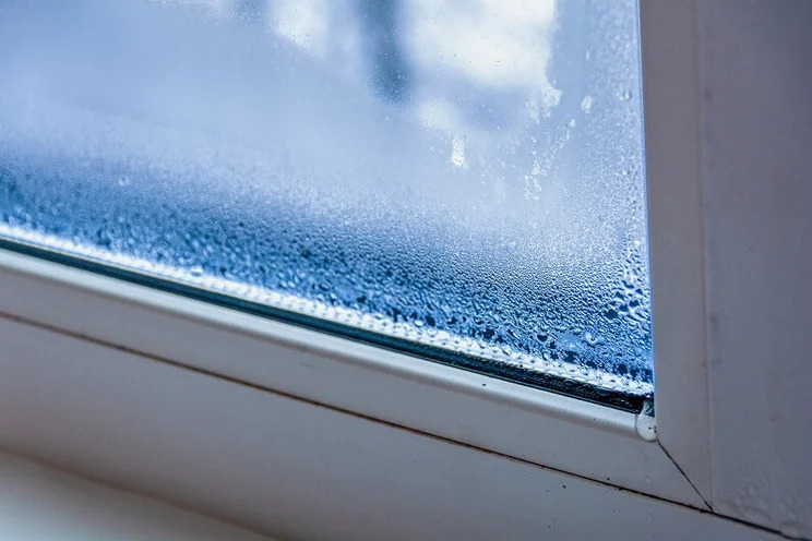 Hazy double-pane window glass with moisture between panes in a Glenwood Springs, Colorado home.